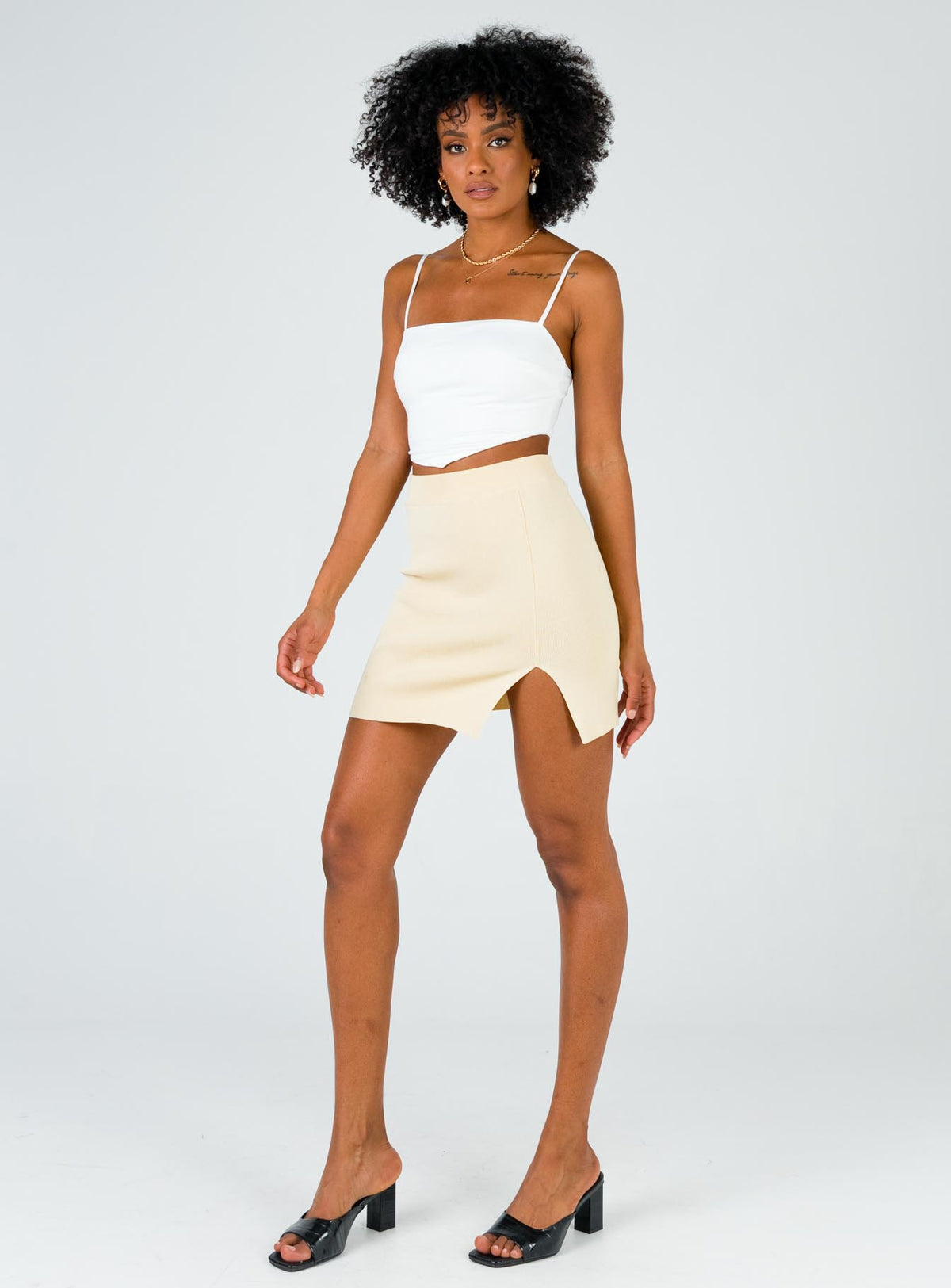   side view of model wearing Princess Polly The Lola Mini Skirt Ecru Skirts 