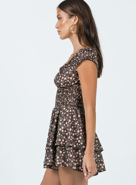 Romper Soft textured material Shirred waistband Ruffle detailing Elasticated neckline Can be worn on or off-shoulder Layered ruffle hem