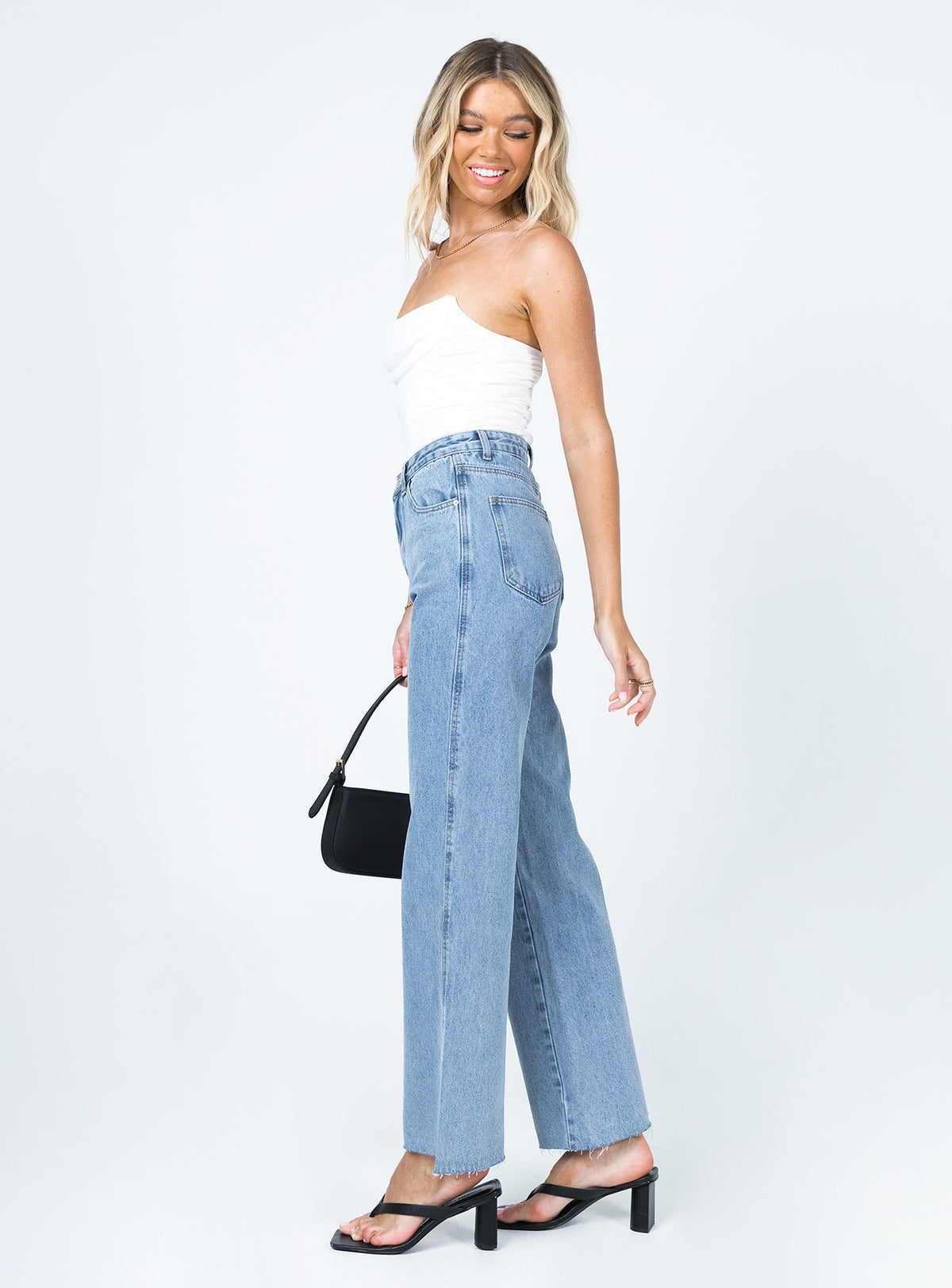 side view of model wearing Princess Polly Arlington High Rise Straight Leg Jeans Denim High Rise Jeans Jeans 