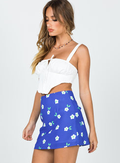   side view of model wearing Princess Polly Selby Mini Skirt Blue Floral Skirts 