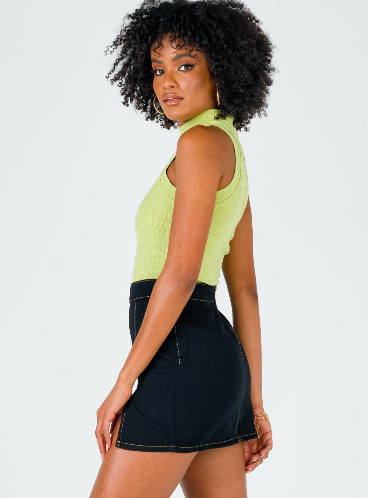   side view of model wearing Princess Polly The Lola Mini Skirt Contrast Stitching Black Skirts 