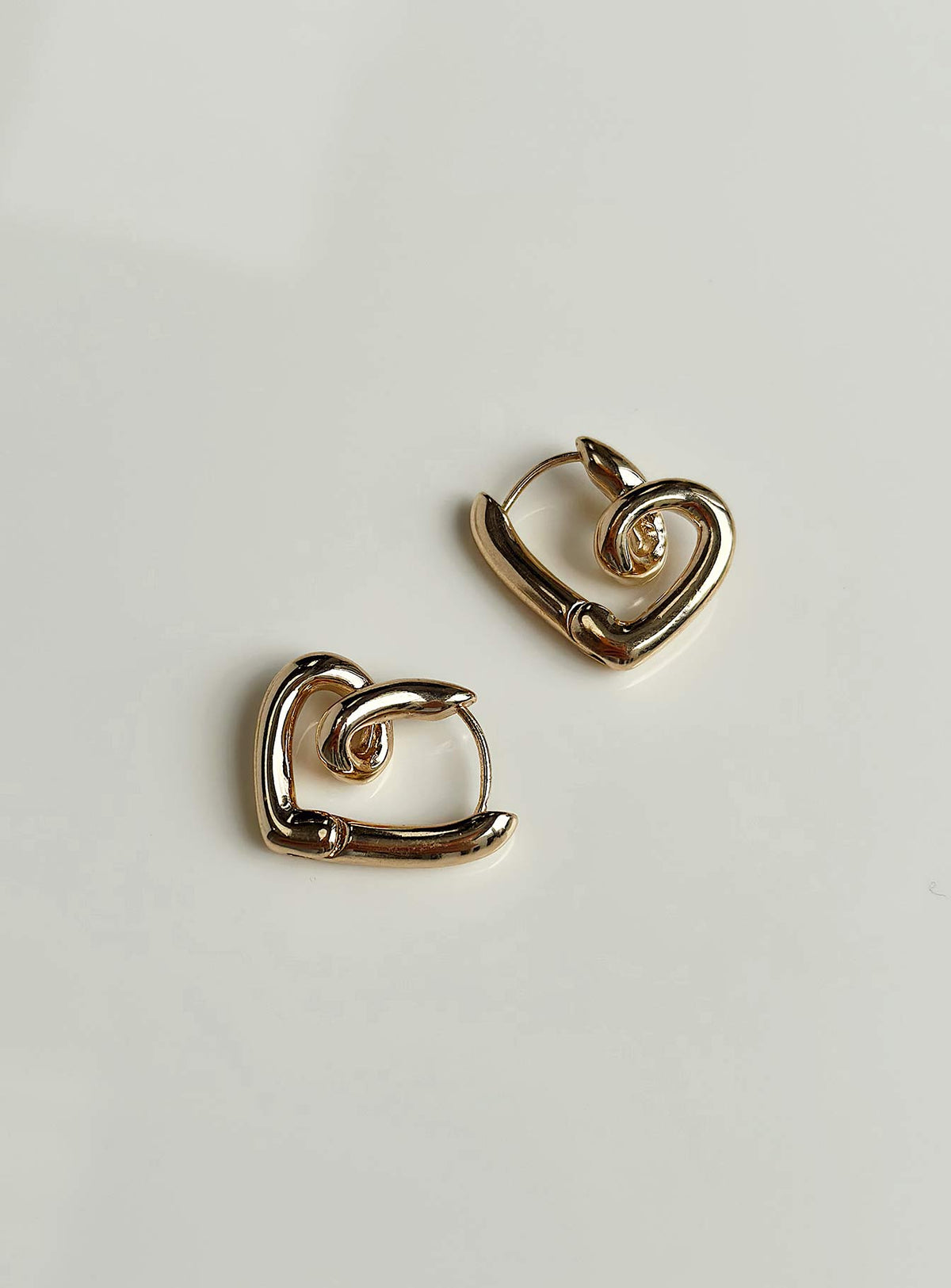 Earrings Gold toned Hinged hoop fastening