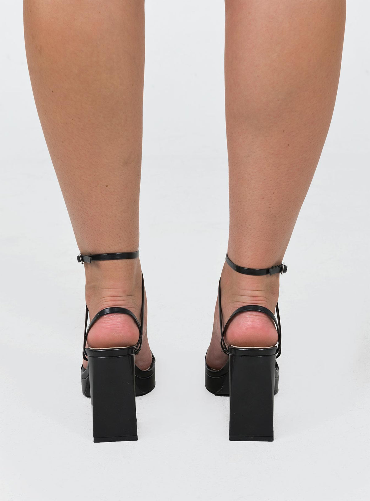 Heels Faux leather material  Strappy upper  Ankle buckle fastening Platform base  Block heel  Square toe 