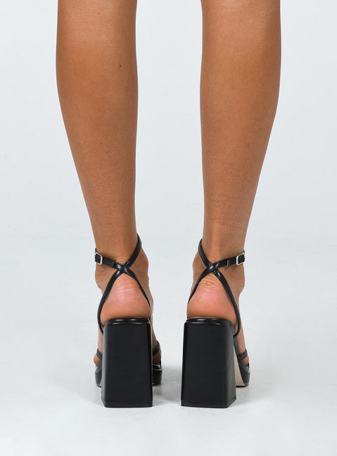 Heels Princess Polly Exclusive Upper & Lining: 100% PU Outer: 100% TPU Faux leather material  Strappy upper  Ankle buckle  Platform base  Black heel  Square toe 