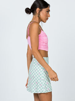   side view of model wearing Princess Polly Selby Mini Skirt Green Floral Check Skirts 