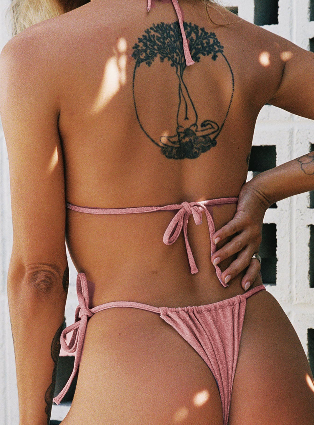 Pink bikini top Sparkle material Triangle style Adjustable coverage Tie fastenings Removable padding Fully lined