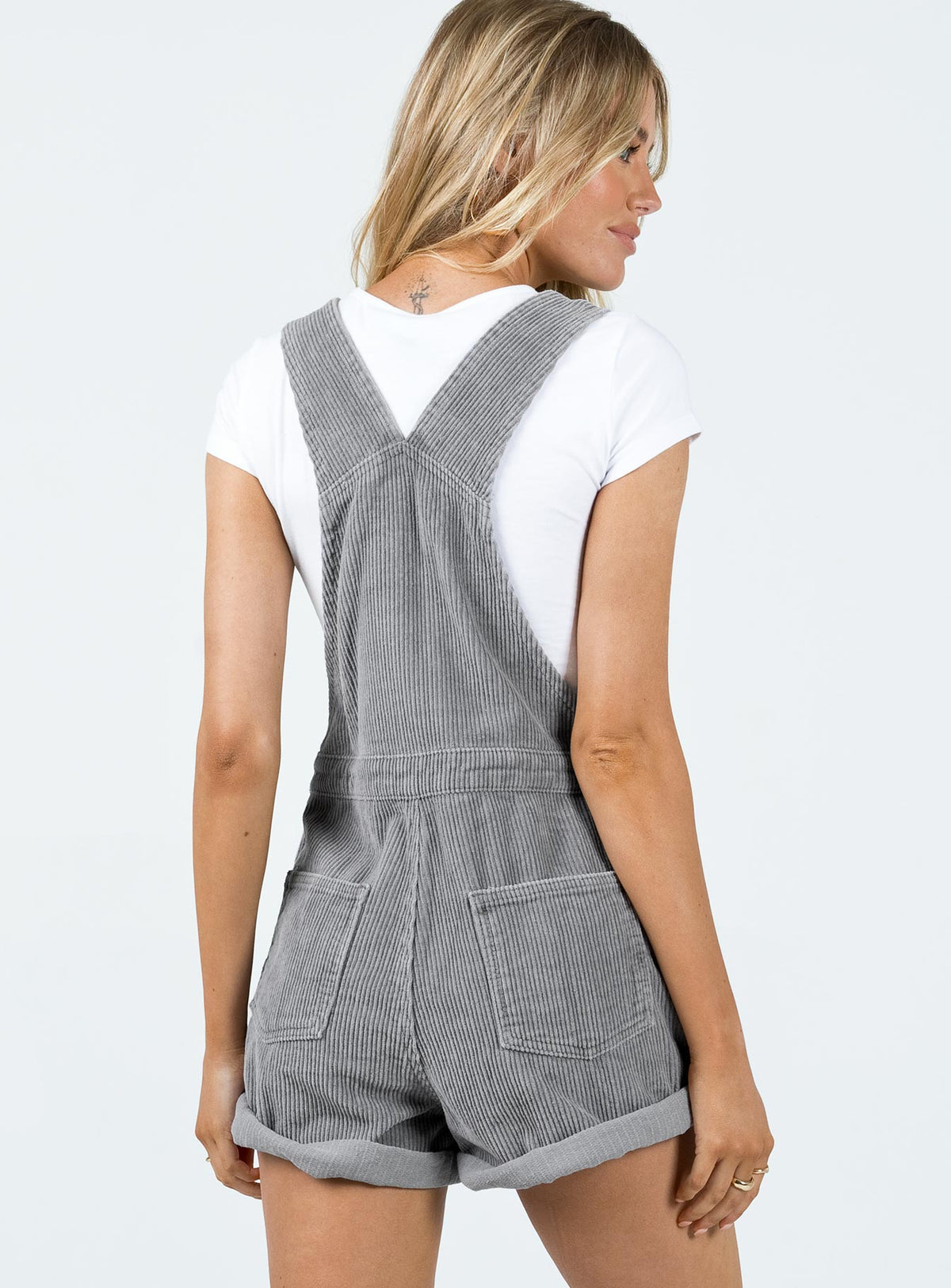 Overalls Corduroy material Adjustable buckle straps Button fastening at sides Large chest pocket Classic four pockets  Gold-toned hardware  Fixed rolled hem