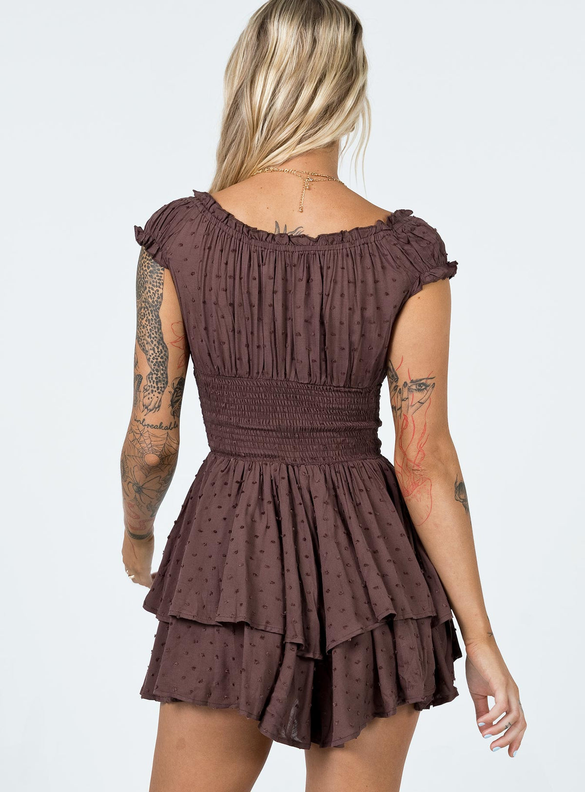Romper Soft textured material Shirred waistband Ruffle detailing Elasticated neck and sleeves Can be worn on or off shoulder Layered ruffle hem Fully lined