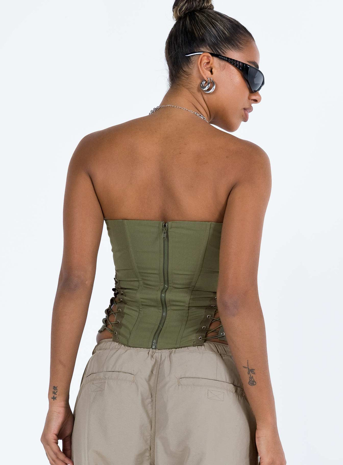 Front view of model wearing  front Princess Polly Sleeveless Square Neck  Eden Lace Up Corset Green