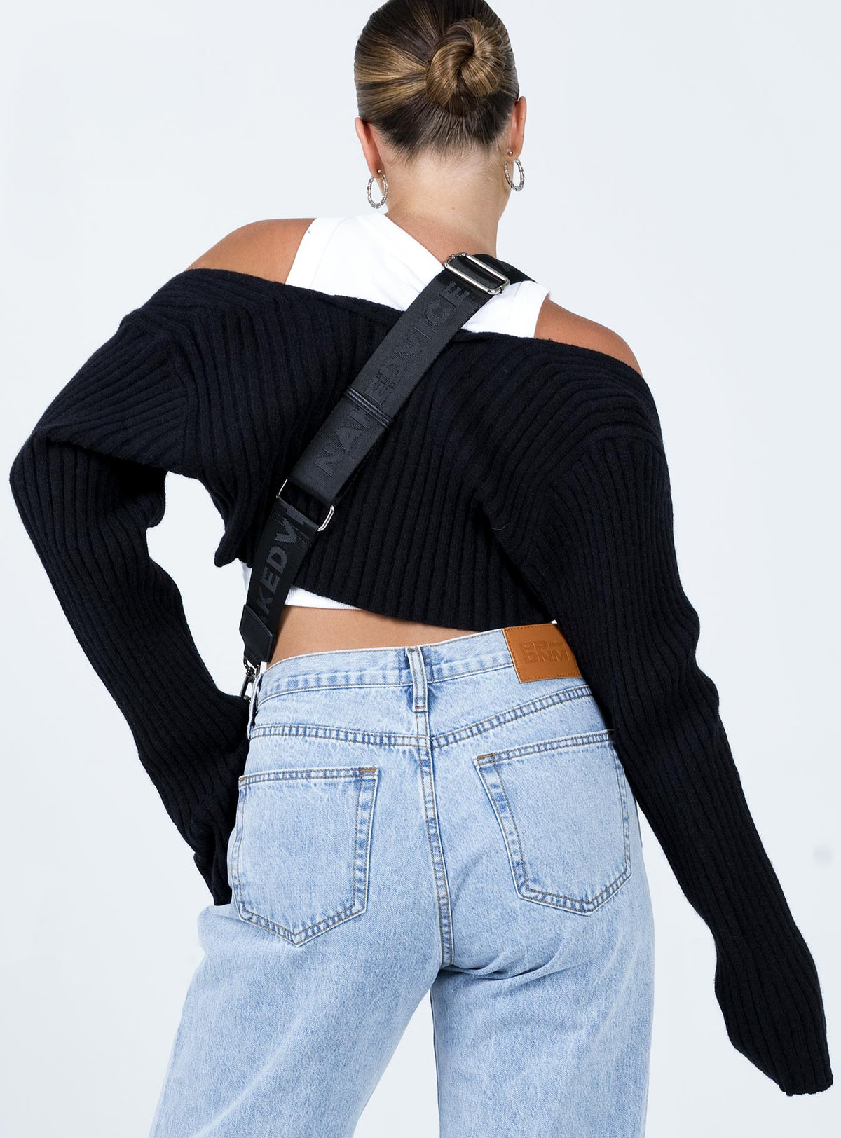 Displaying Aytan Bolero Sweater Black womens-jumpers in short back view of model wearing Princess Polly