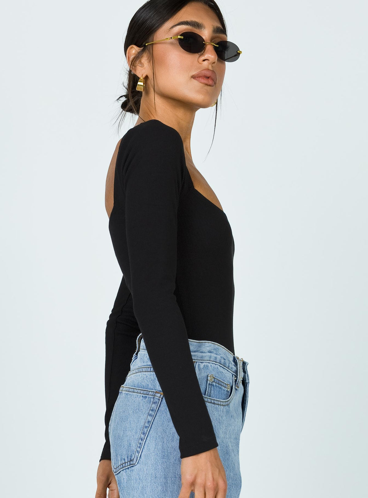 side view of model wearing Princess Polly Charlotte Bodysuit Black Long Sleeve Tops Bodysuit 