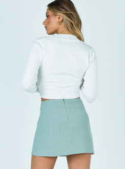 back view of model wearing Princess Polly Selby Mini Skirt Green Skirts 