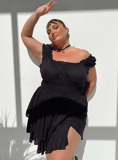 Black romper Can be worn on or off the shoulder Soft textured material Shirred waistband Ruffle detailing