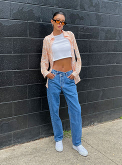 front view of model wearing Princess Polly Holly Asymmetric Straight Leg Jean Mid Wash Denim Mid Rise Jeans Jeans 