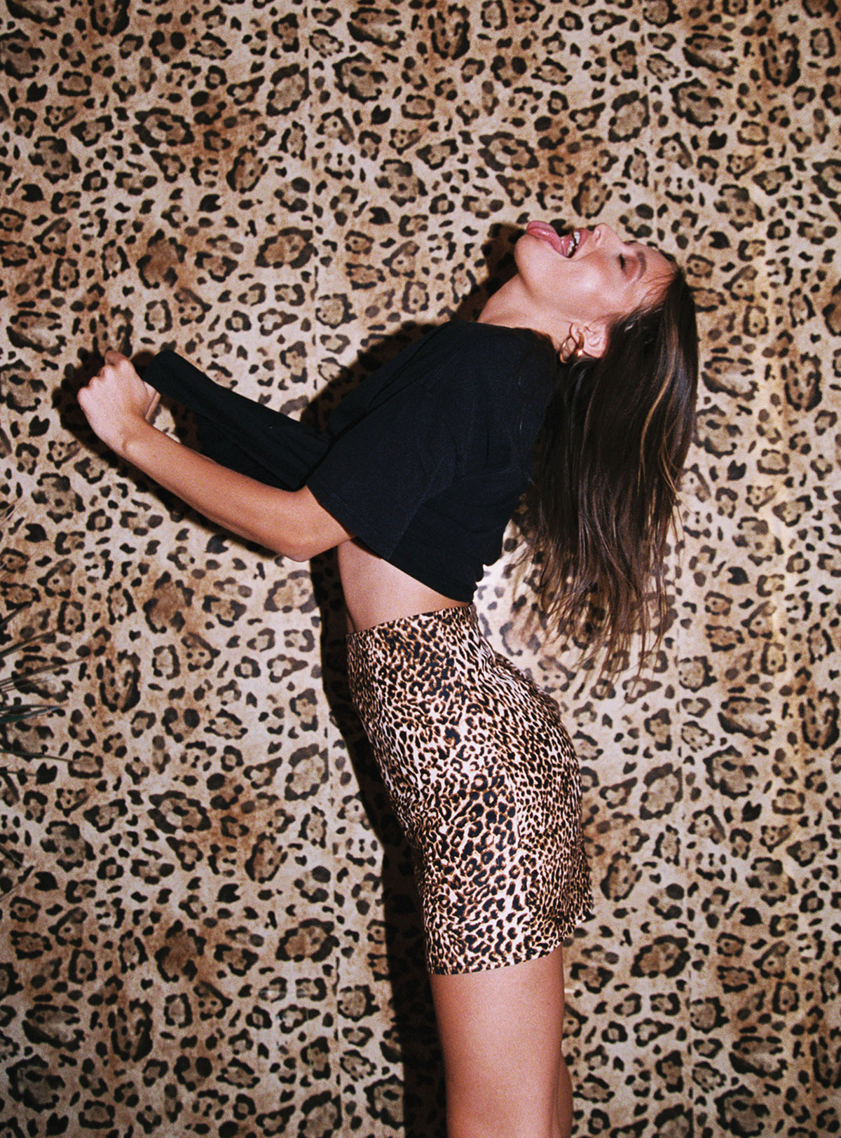 back view of model wearing Princess Polly Selby Mini Skirt Leopard Skirts 