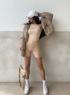 Puffer jacket Zip front fastening Twin hip pockets High neckline Ribbed cuffs Drawstring waist